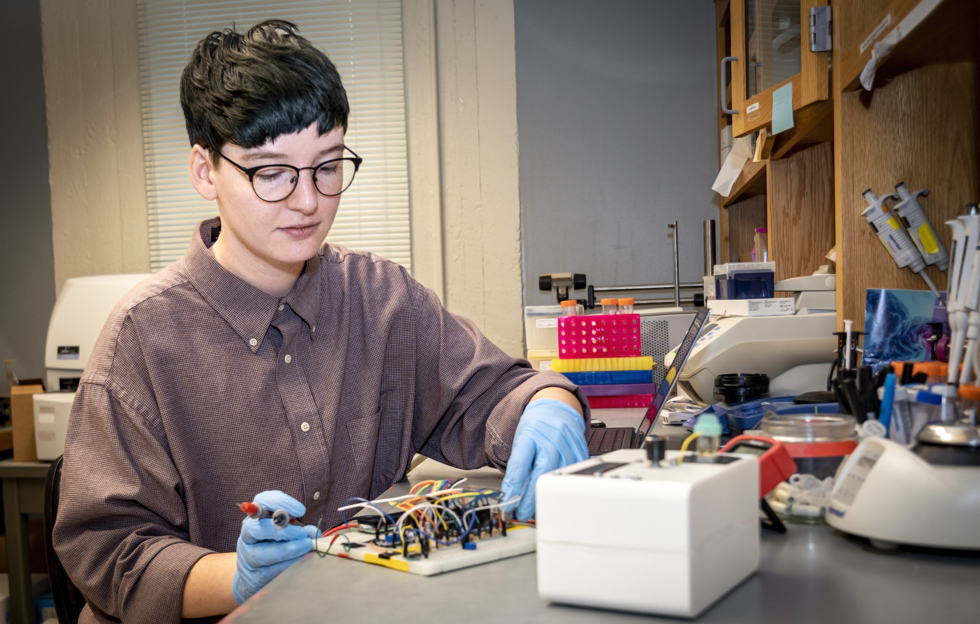 Cel Welch at bench in lab