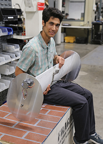 Alex Koh-Bell with wing in Breuer Lab 