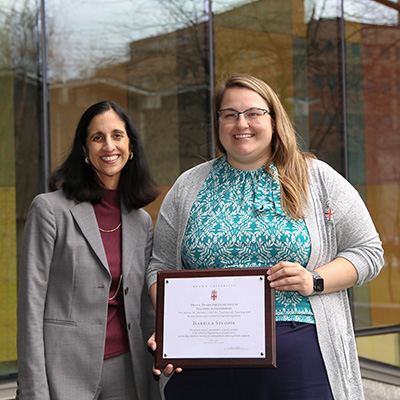 Dean Desai and Isabella Stuopis with award