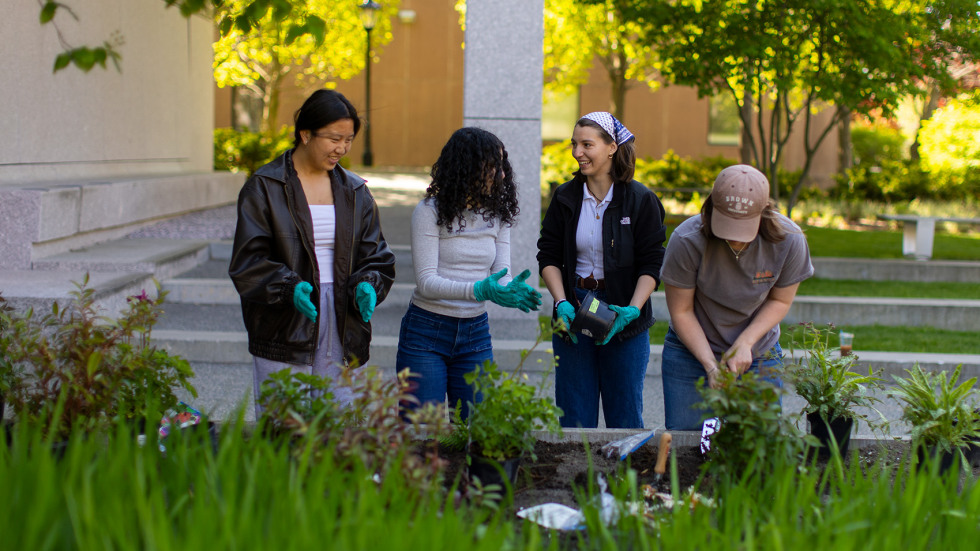 students planting in the memorial garden together