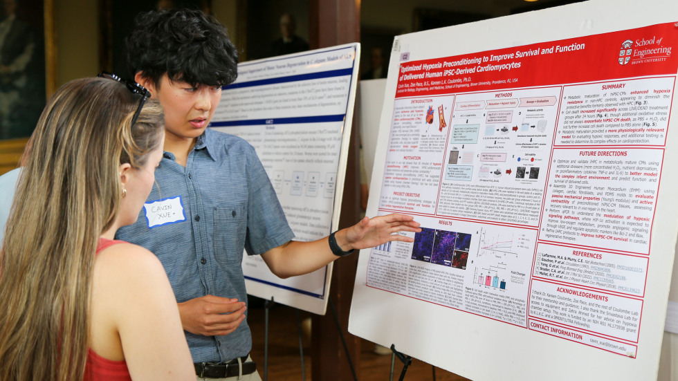 Cavin Xue presenting his poster